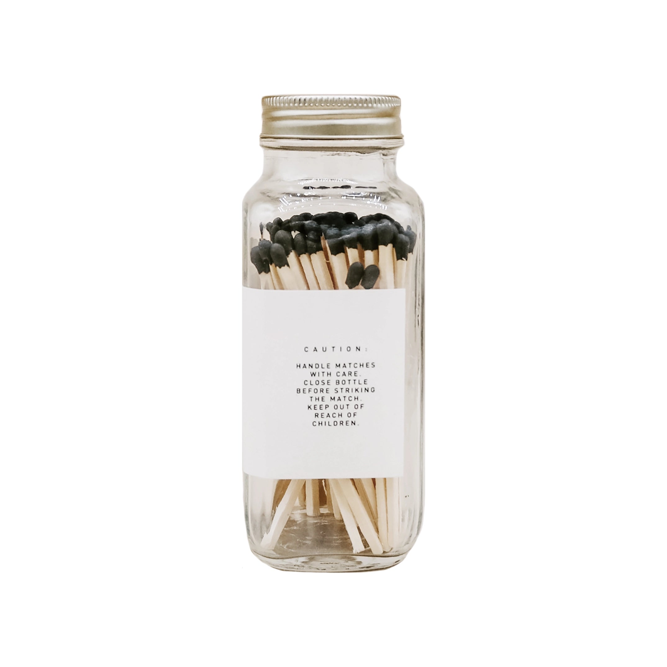 Glass jar with matches on a white background