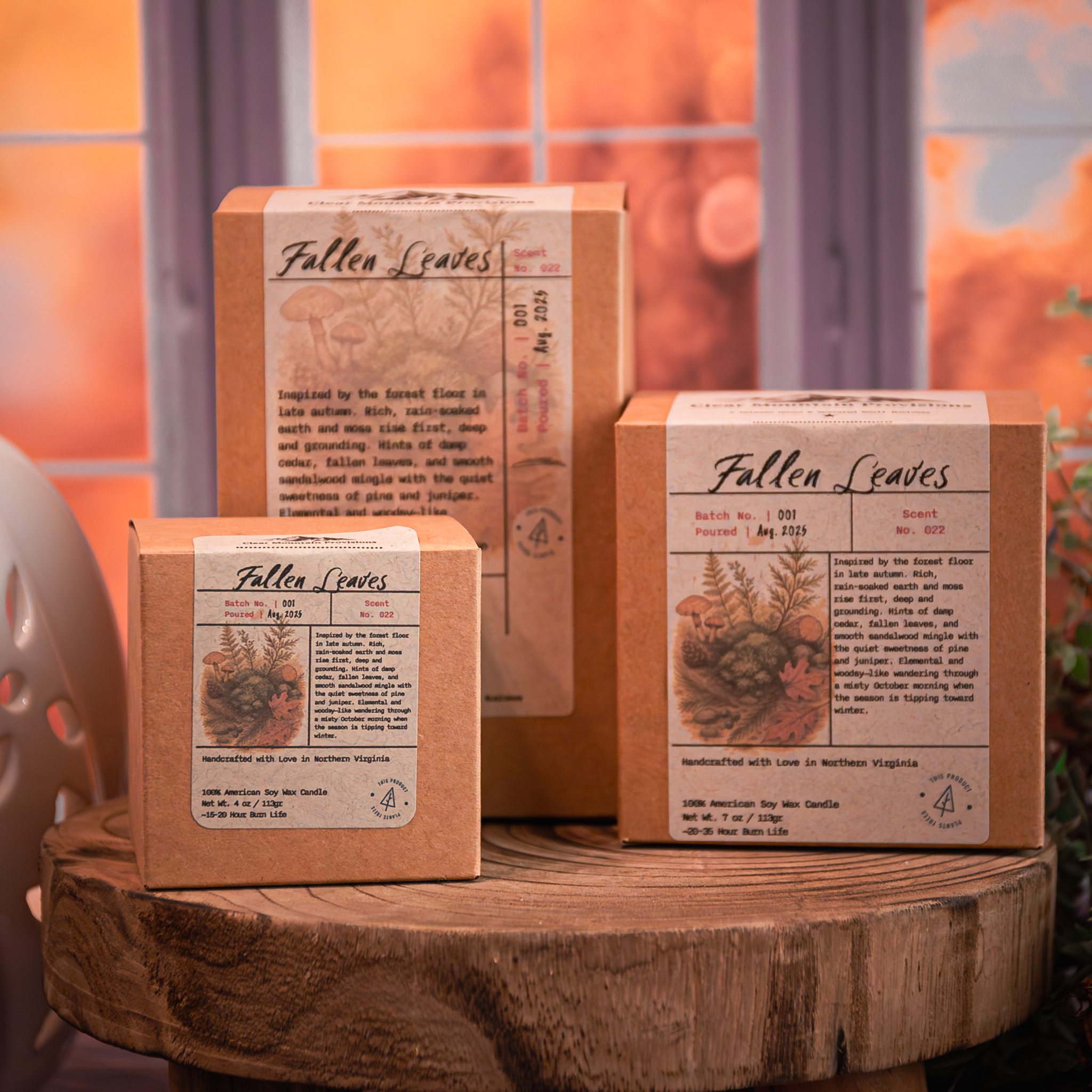 Autumn candle in glass jar surrounded by fall leaves – Fallen Leaves fragrance