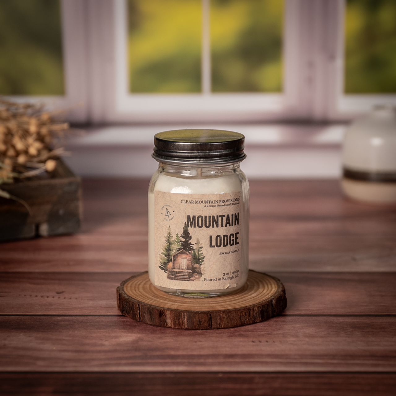 Mountain Lodge soy wax candle with leather, tobacco, and smoky oud scent in eco-friendly jar