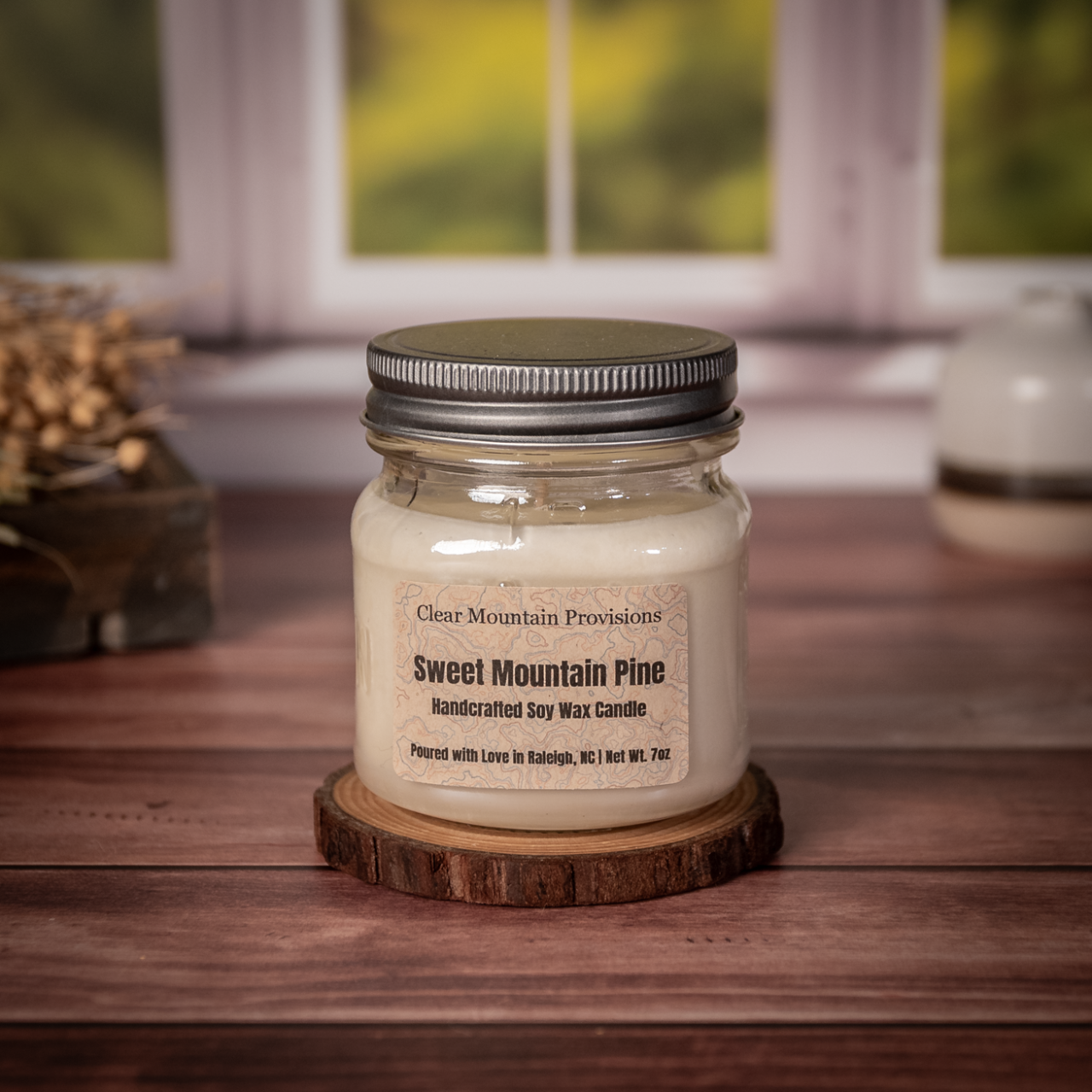 Sweet Mountain Pine soy wax candle with fir, pine, and eucalyptus scent inspired by Mount Mitchell in eco-friendly jar.