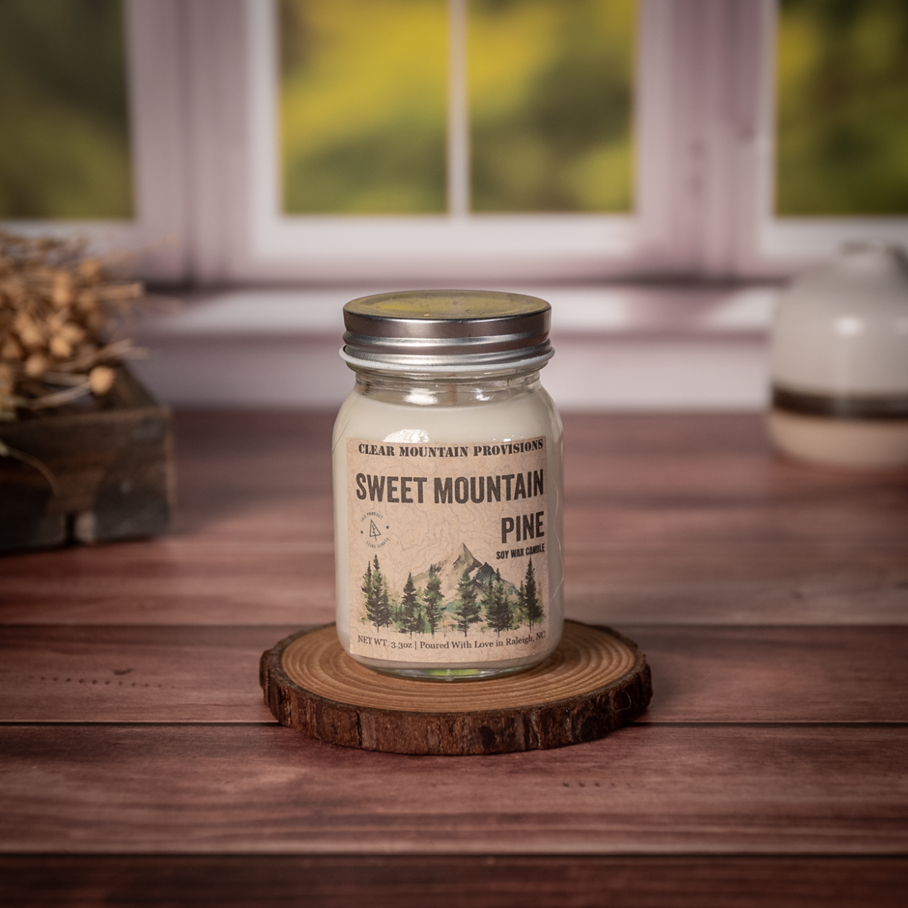 Sweet Mountain Pine soy wax candle with fir, pine, and eucalyptus scent inspired by Mount Mitchell in eco-friendly jar.