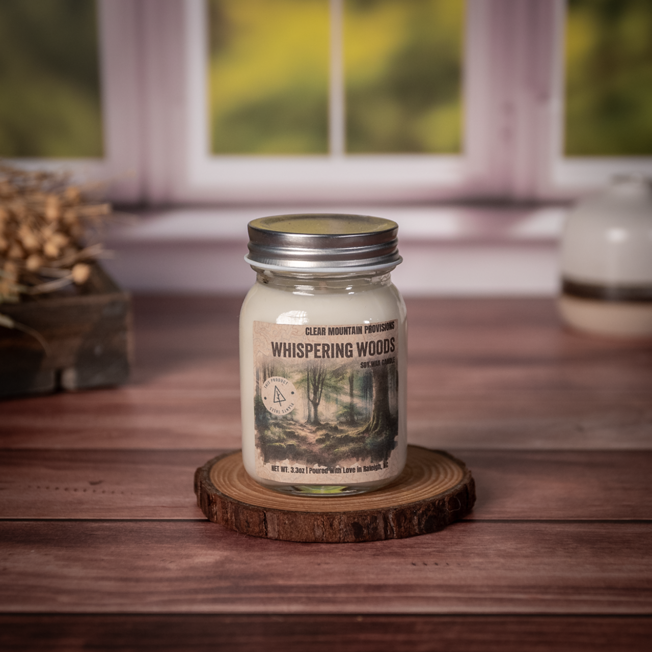 Whispering Woods soy wax candle with oakmoss, citrus, and amber scent in eco-friendly jar