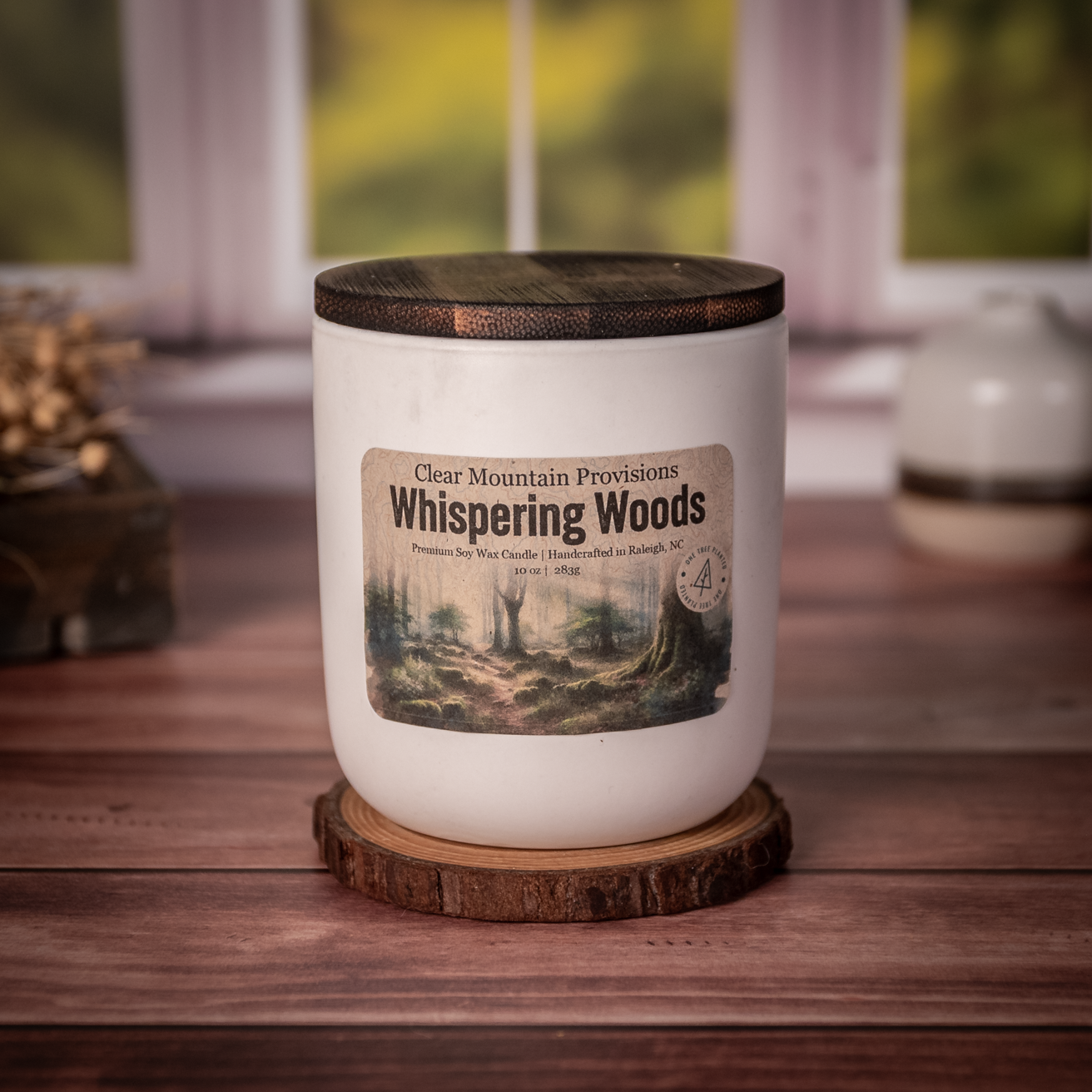 Whispering Woods soy wax candle with oakmoss, citrus, and amber scent in eco-friendly jar